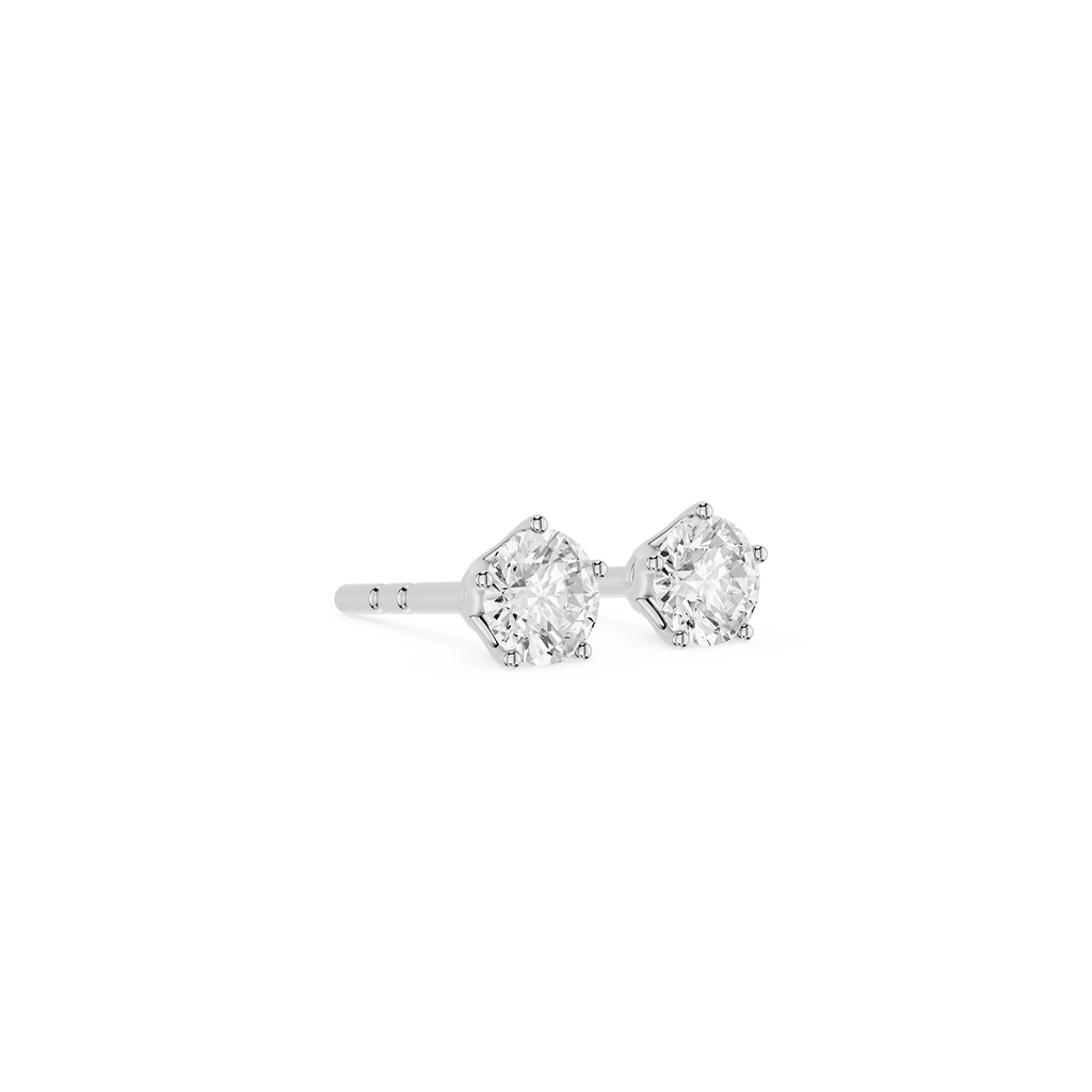 Pair of diamond stud earrings on a white background