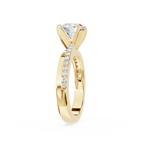Gold ring with a diamond on a white background