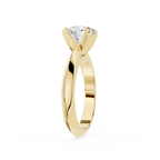 Gold ring with a diamond on a white background