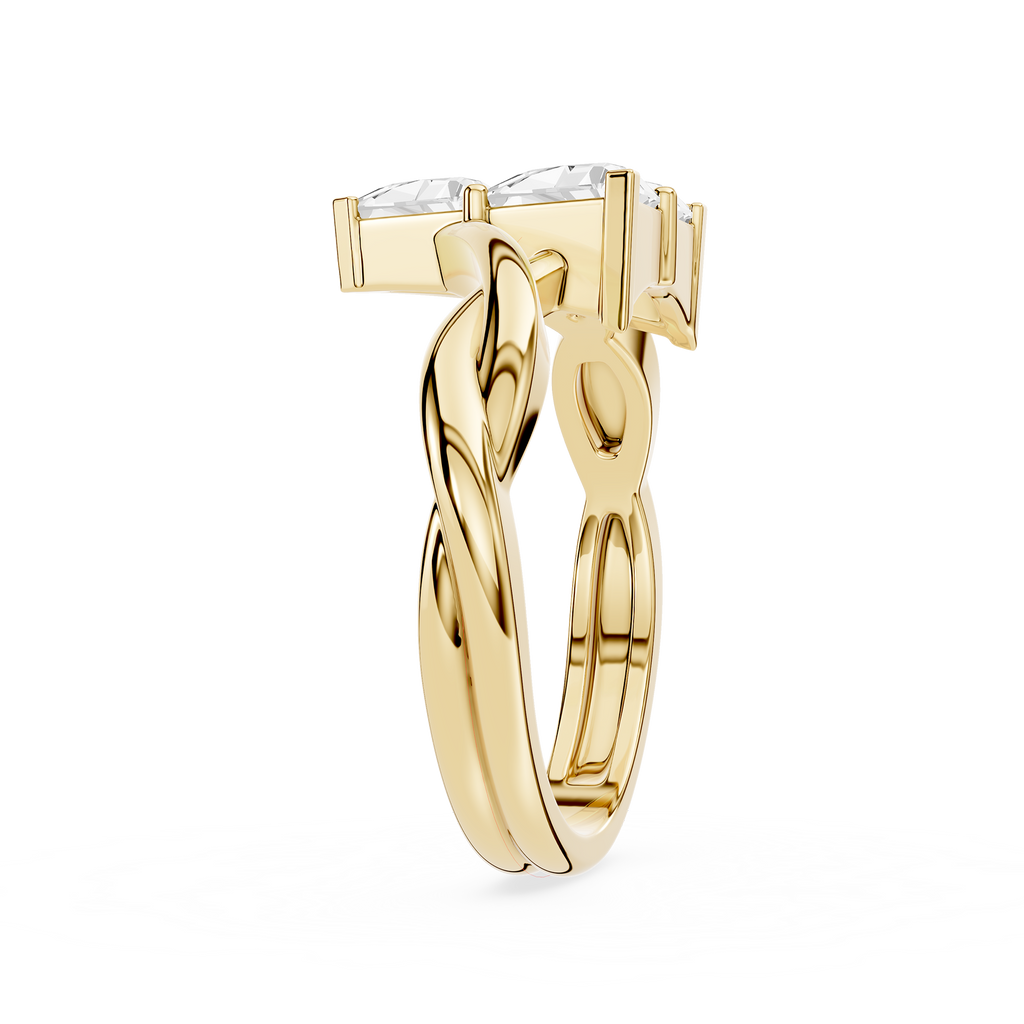 Gold ring with a twisted design on a white background