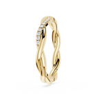 Gold ring with diamond accents on a white background