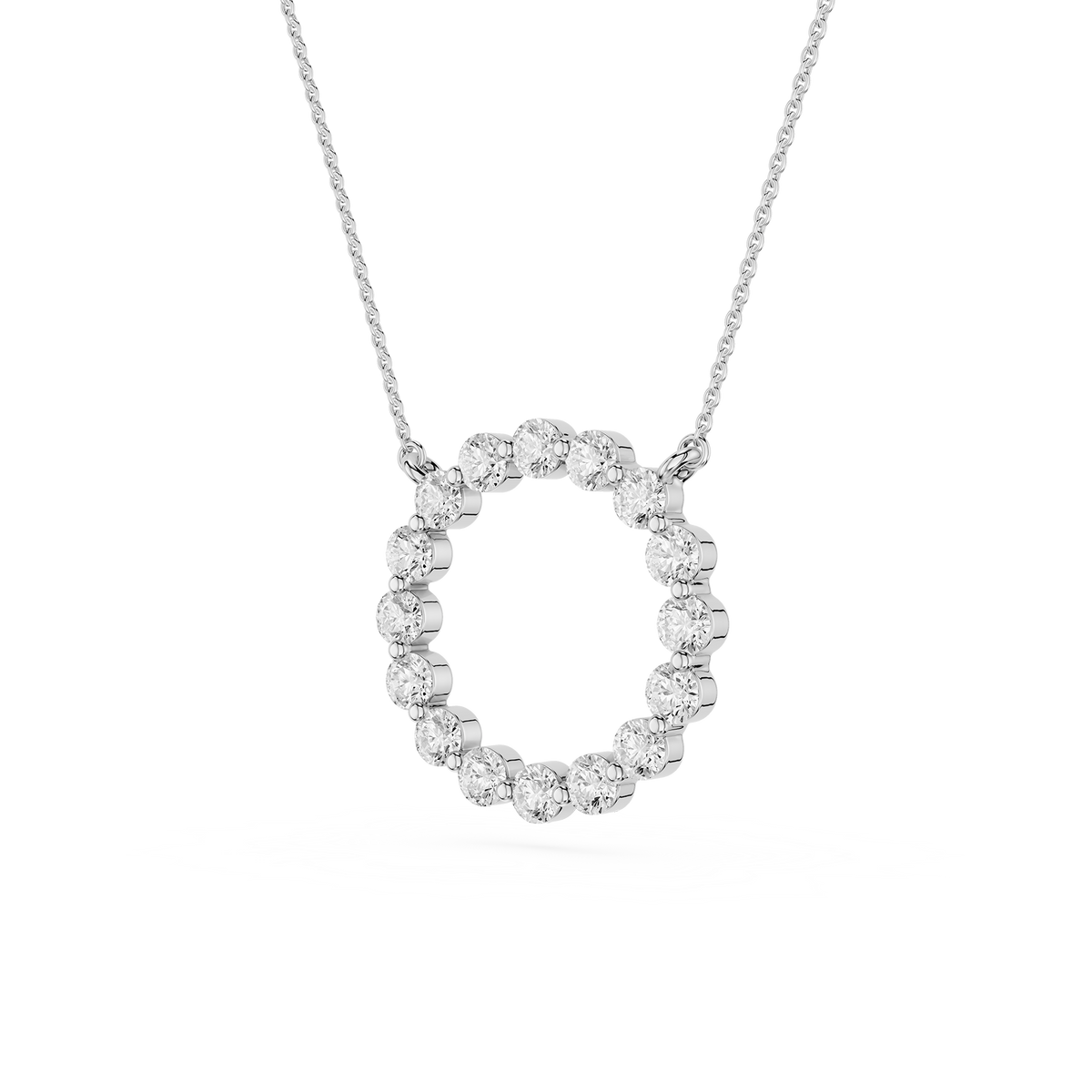Silver necklace with a circular pendant on a white background