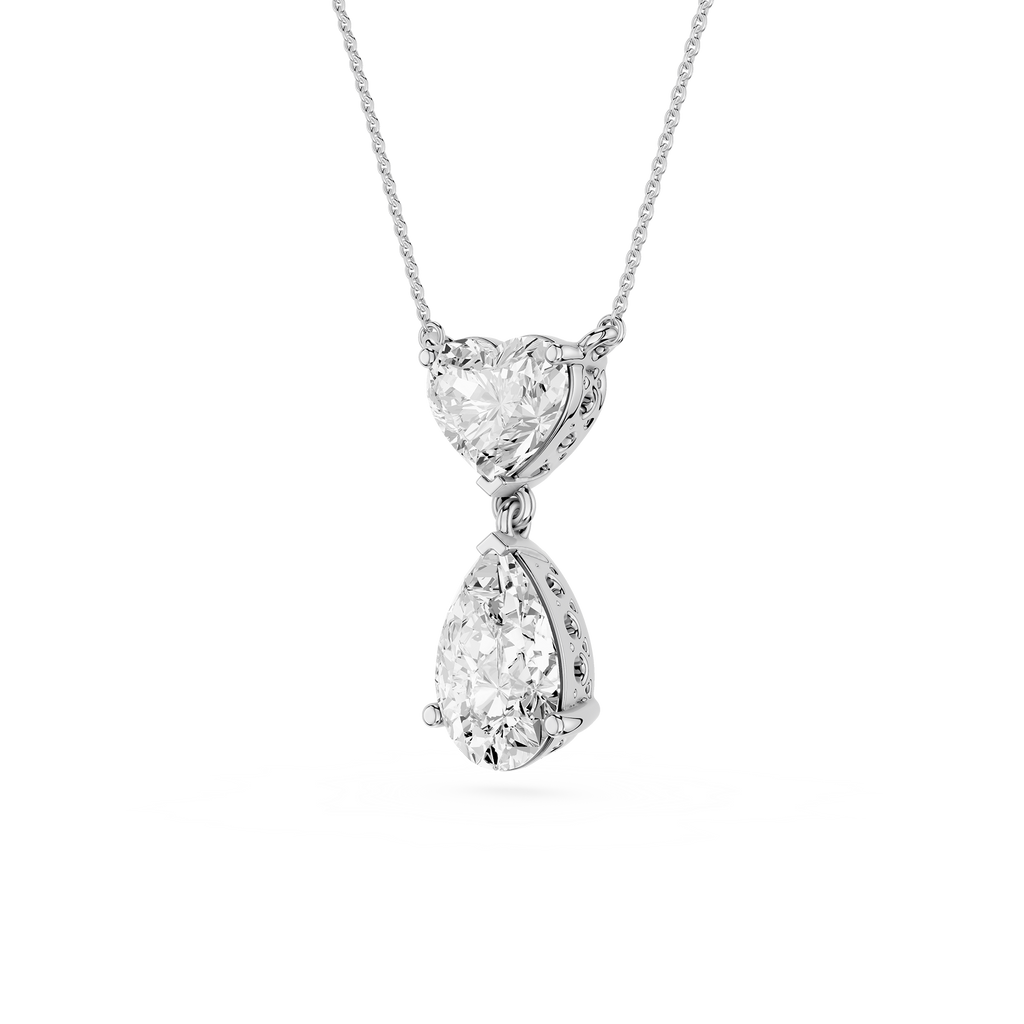 Diamond necklace with heart and teardrop pendants on a white background