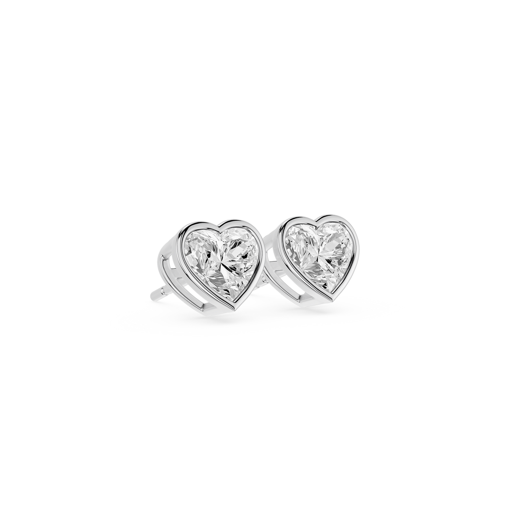 Heart-shaped diamond earrings on a white background