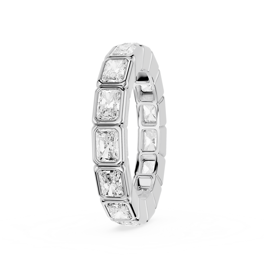 A silver-toned eternity ring featuring a row of rectangular baguette-cut clear gemstones, shown on a clean white background.