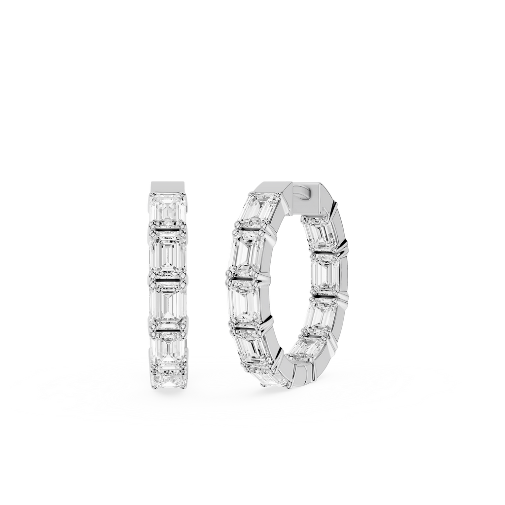 Pair of diamond hoop earrings on a white background