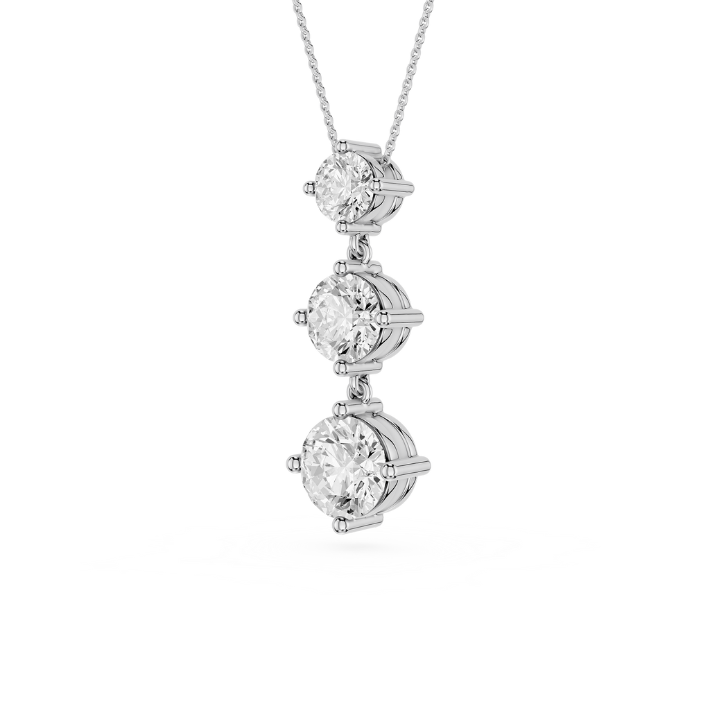 Diamond necklace with three round-cut diamonds on a white background