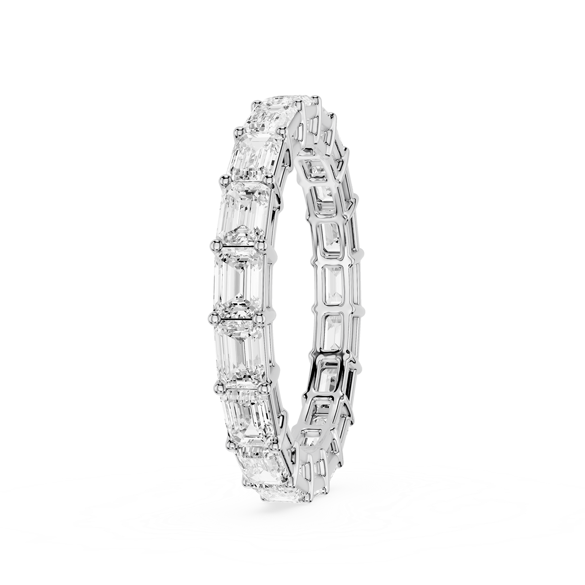 A silver-toned eternity band ring featuring a continuous row of baguette-cut clear gemstones, shown on a plain white background.