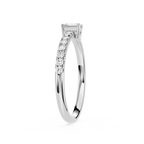 Silver ring with diamond accents on a white background