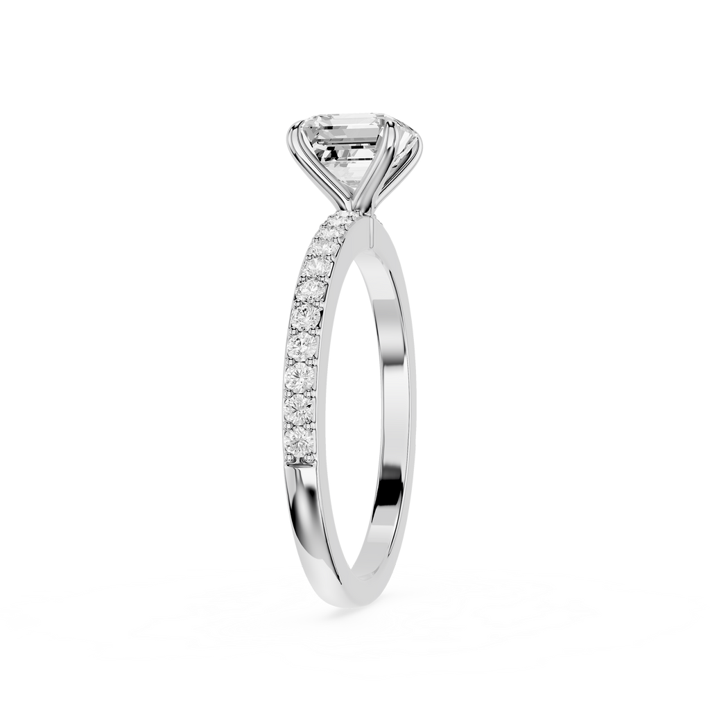A silver-tone diamond ring with a large emerald-cut center stone and a pavé-set diamond band, shown on a plain white background.