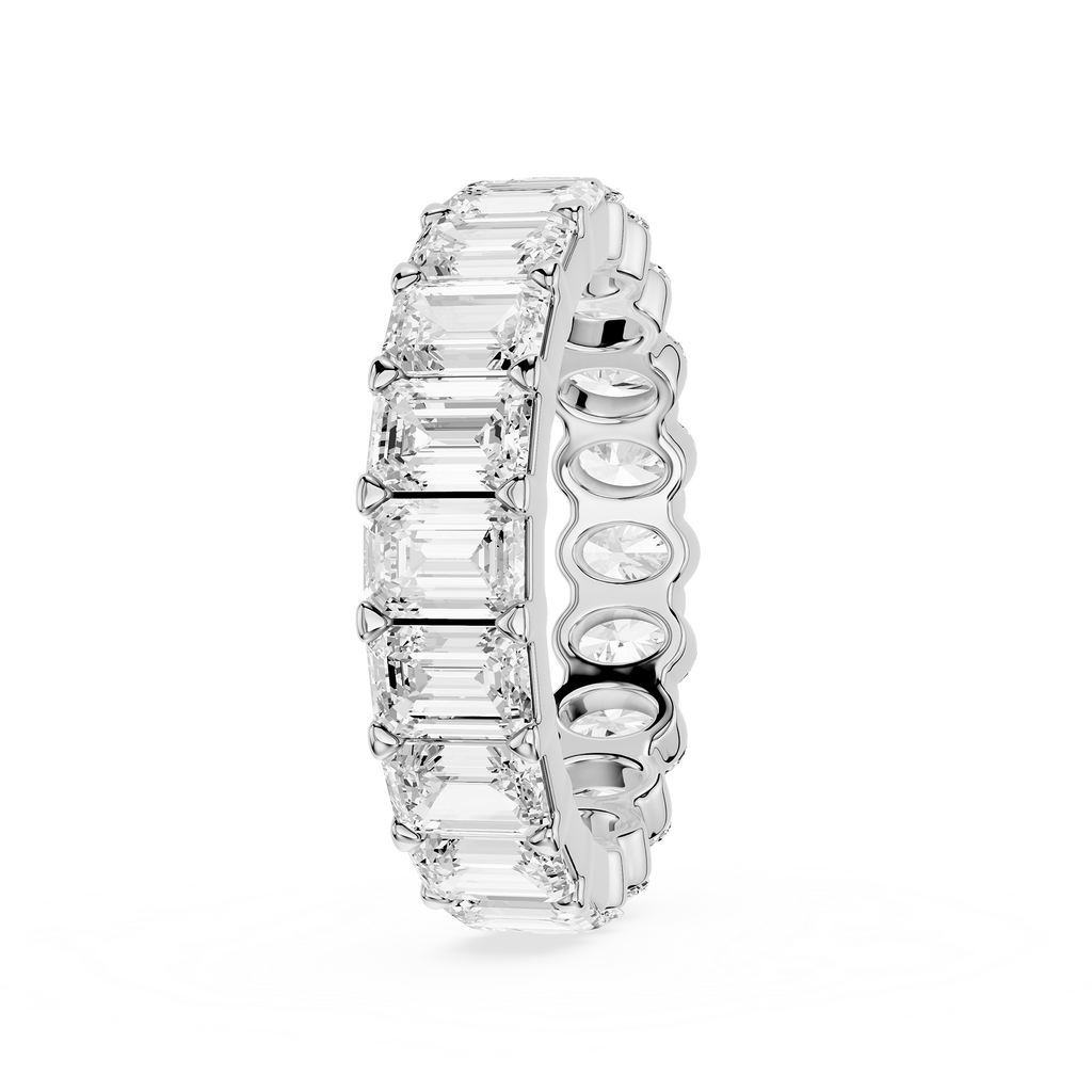 Silver ring with embedded diamonds on a white background