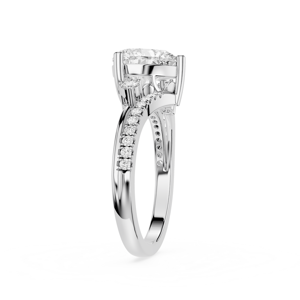 A silver-toned diamond ring with a round-cut center stone and a pavé band, shown on a clean white background.