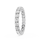 A silver-toned eternity ring featuring a continuous row of round-cut clear gemstones in a prong setting, shown on a plain white background.
