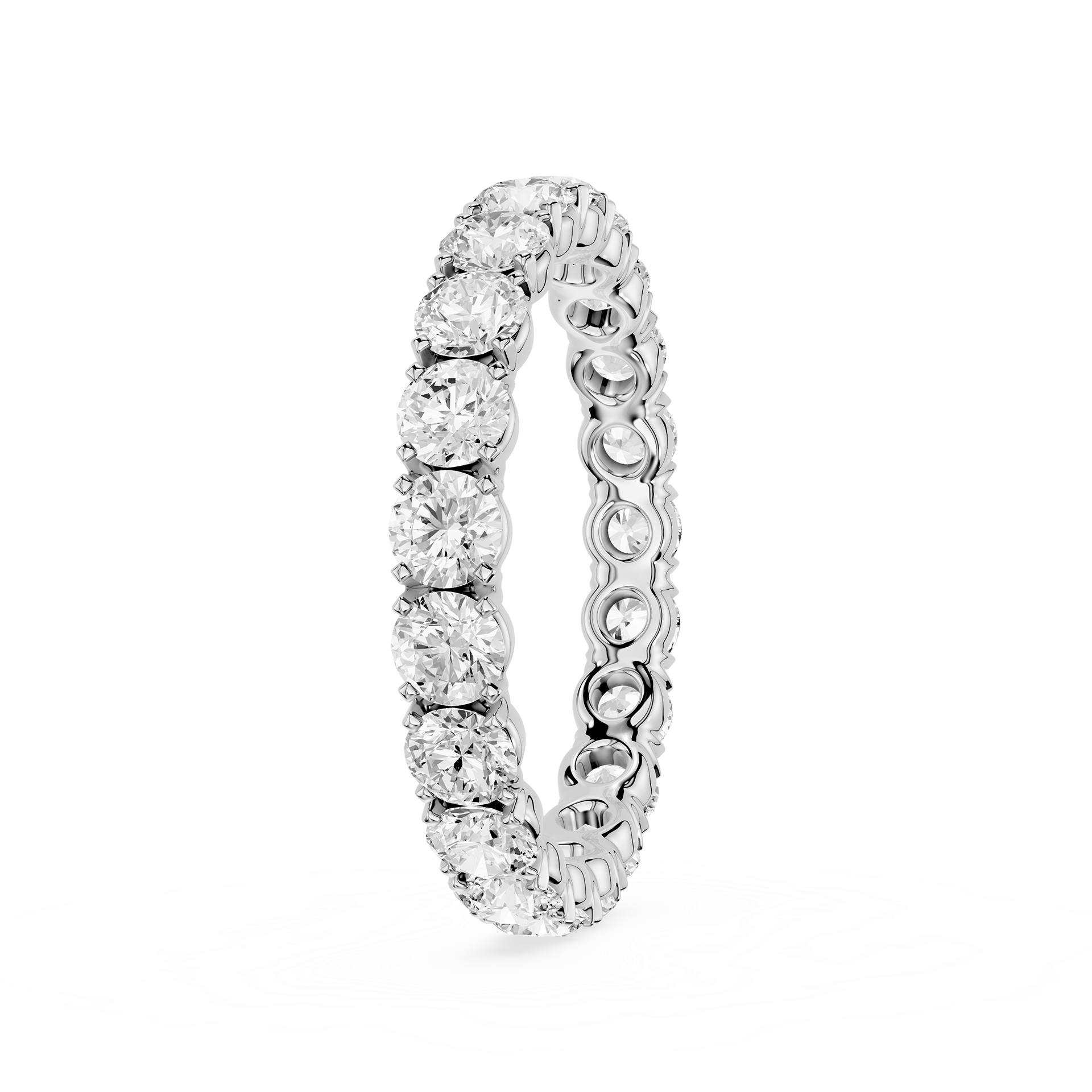 A silver-toned eternity ring featuring a continuous row of round-cut clear gemstones in a prong setting, shown on a plain white background.