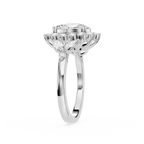 A silver-toned diamond ring with a large round-cut center stone and a surrounding halo of smaller diamonds, shown on a clean white background.