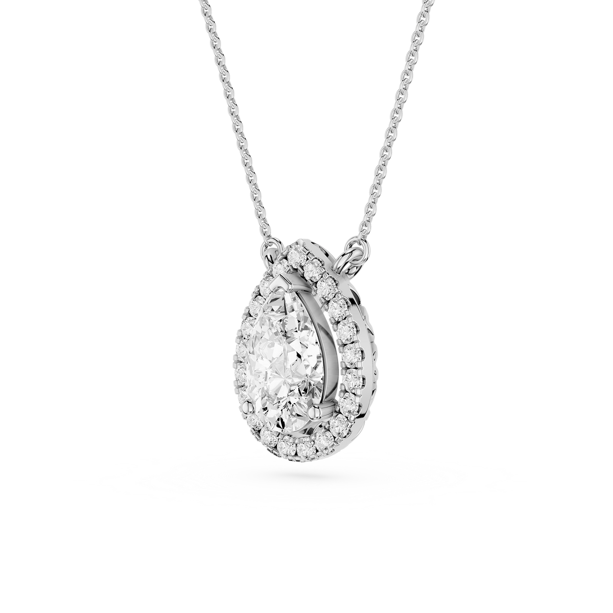 A delicate white gold cable chain holds a pear-shaped diamond pendant with a three-prong setting and pave-style halo 