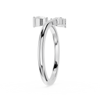 A polished silver-toned double hoop ring with small square bezel-set clear stones on the front, shown on a plain white background.