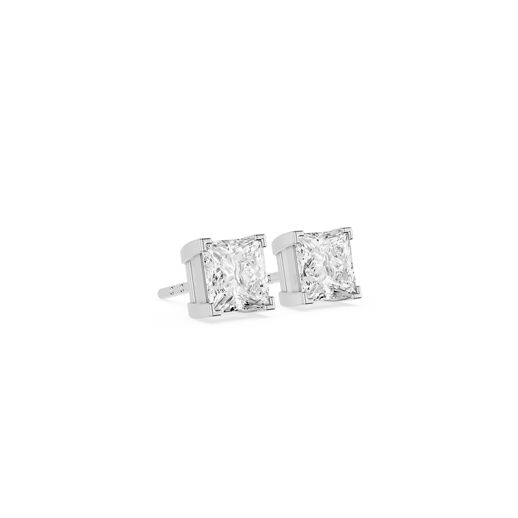 Pair of diamond stud earrings on a white background
