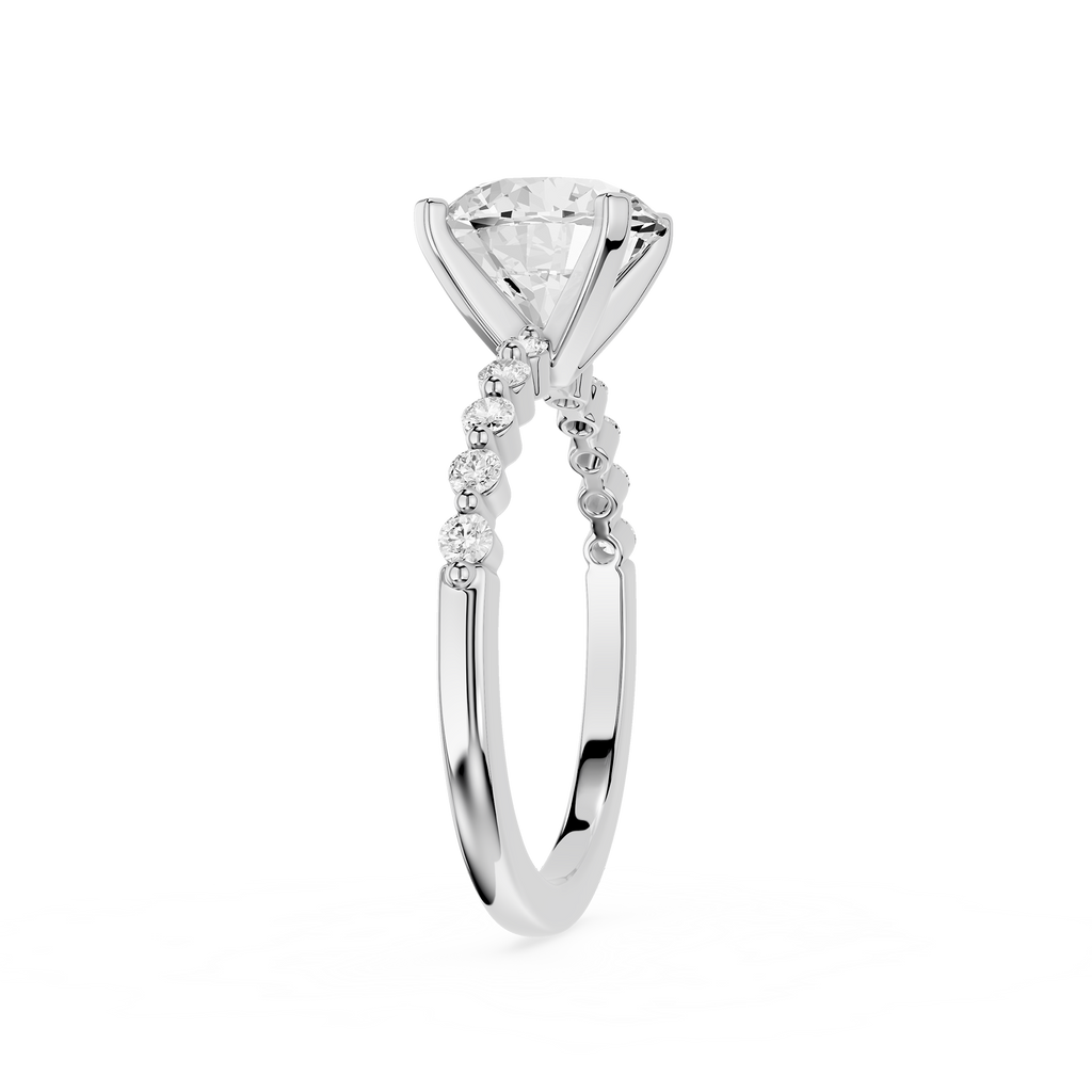 A yellow gold solitaire engagement ring featuring a large round brilliant-cut diamond center stone and a pavé band with small accent diamonds, shown on a plain white background.