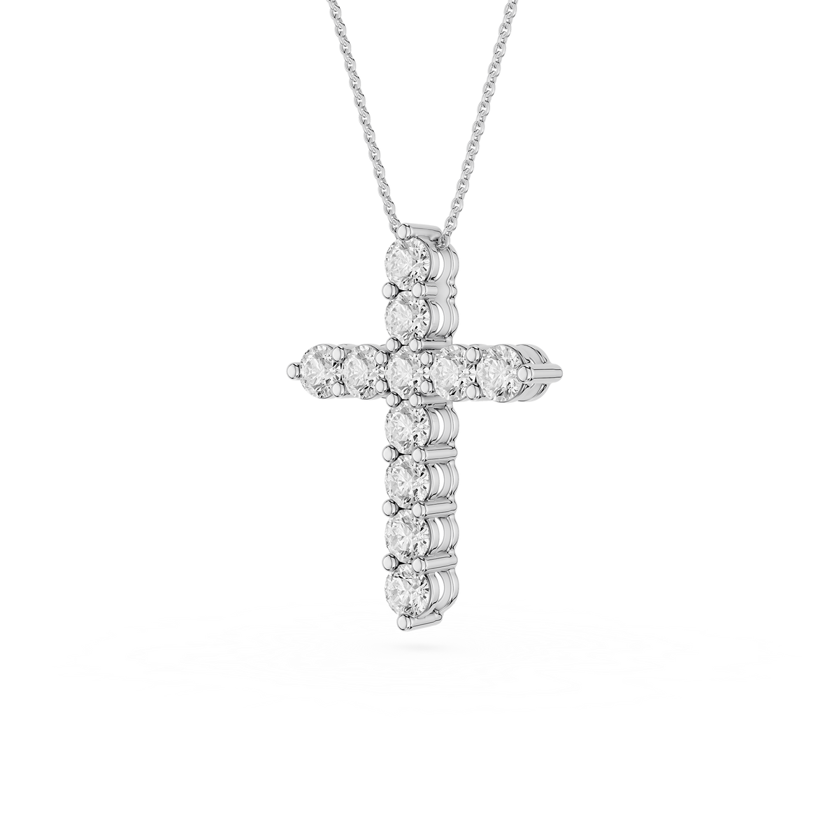 Diamond cross pendant on a white background