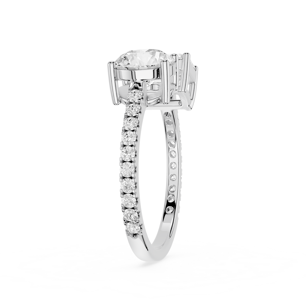 A yellow gold diamond ring with a large round-cut center stone and a pavé band set with small round diamonds, shown on a plain white background.