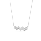 Silver necklace with five round diamonds on a white background