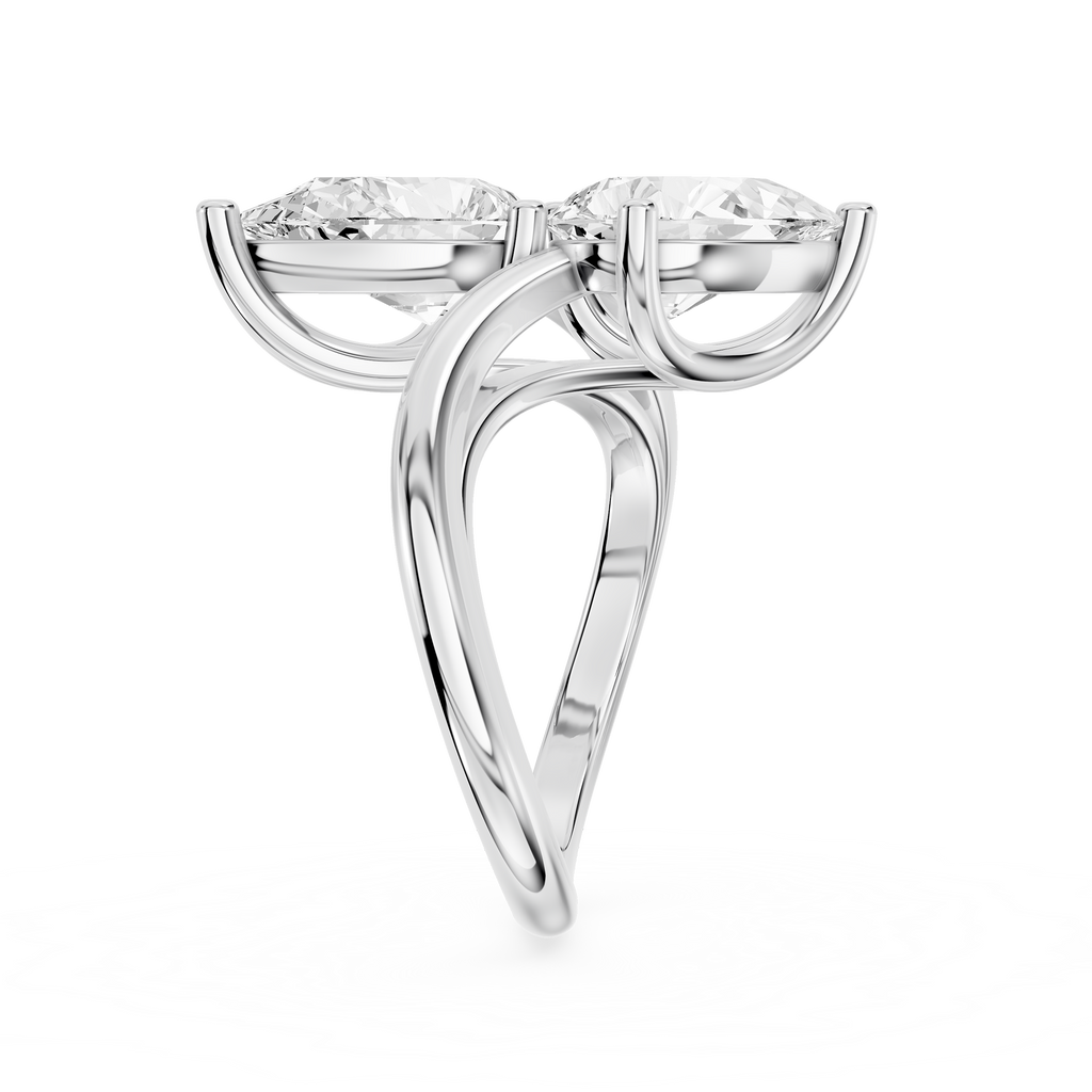 Opposite facing pear shaped diamonds form a two stone ring design on a polished white gold split shank