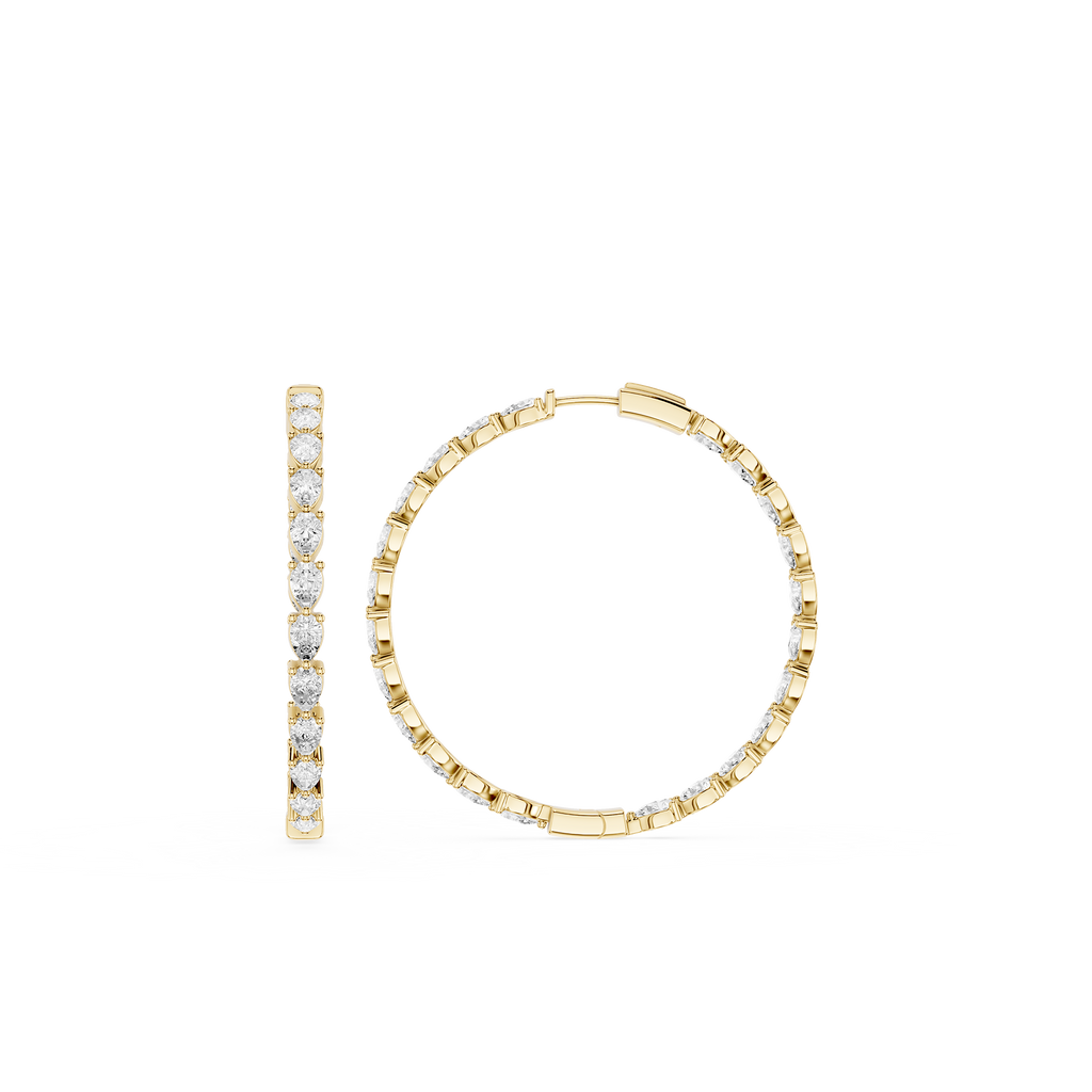 Gold hoop earrings with embedded diamonds on a white background