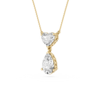 Gold necklace with heart and teardrop-shaped diamond pendants on a white background
