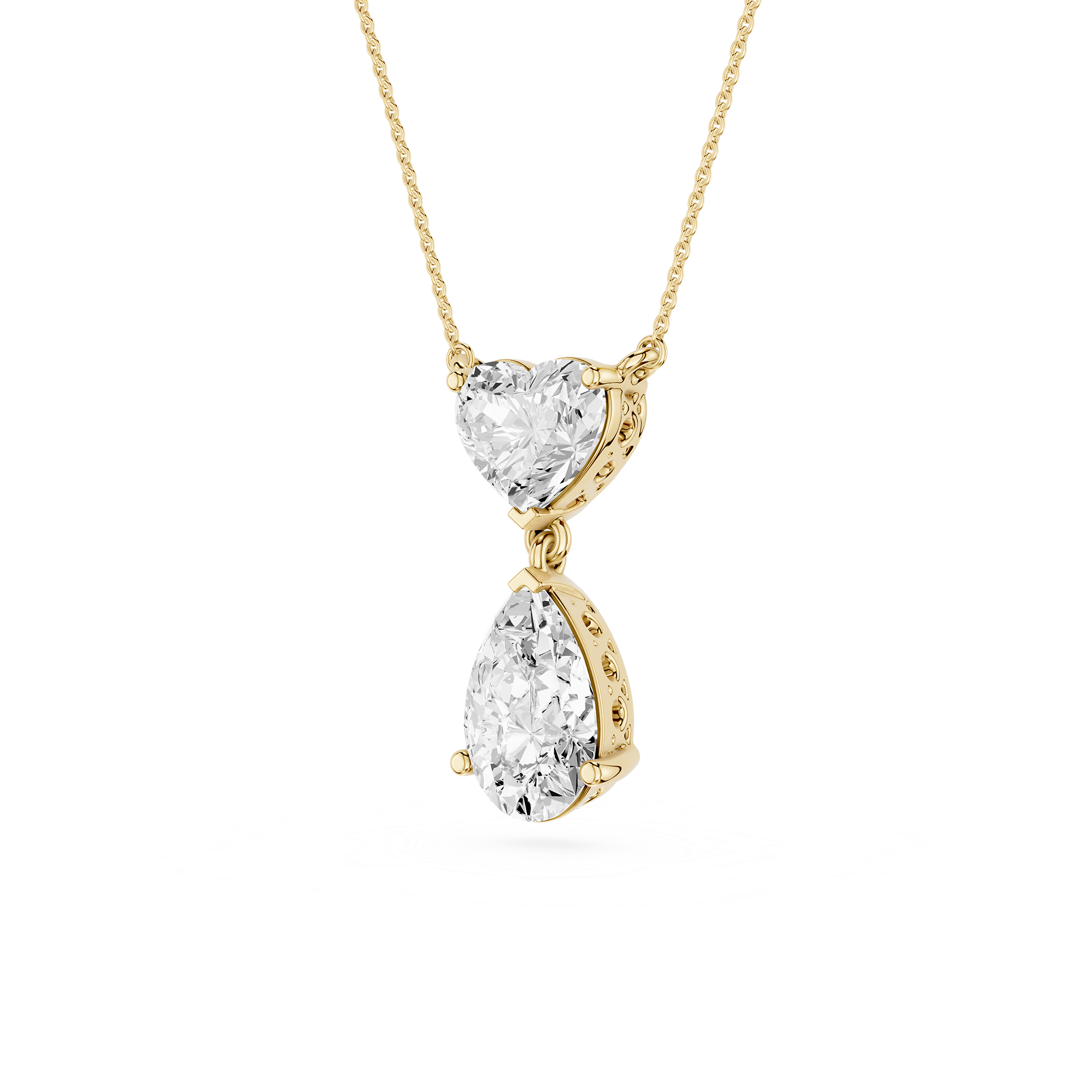 Gold necklace with heart and teardrop-shaped diamond pendants on a white background