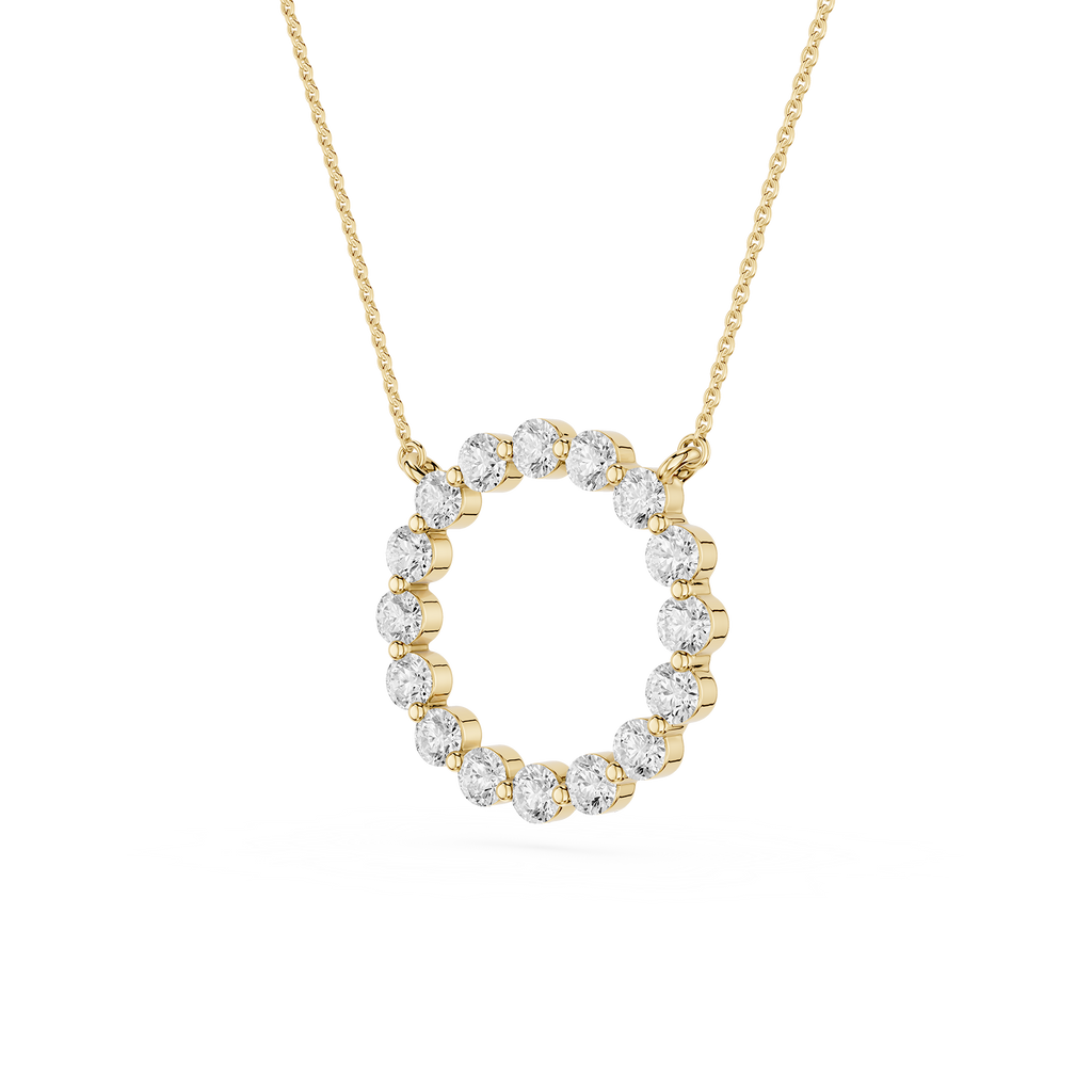 Gold necklace with a circular diamond pendant on a white background