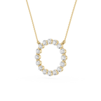 Gold necklace with a circular diamond pendant on a white background