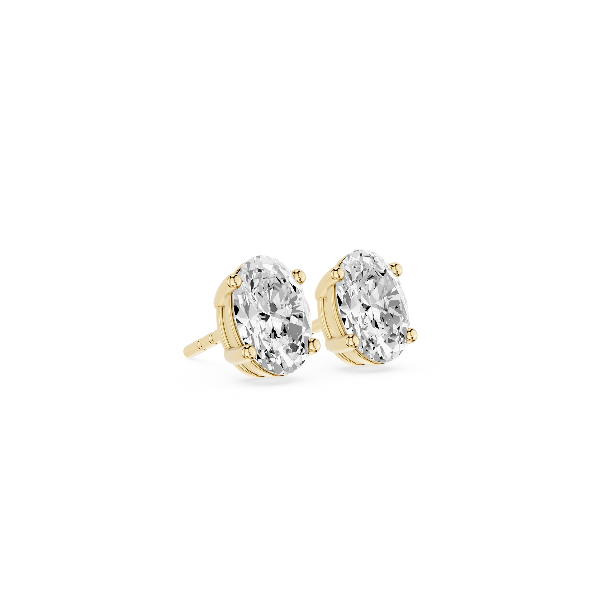Gold earrings with clear gemstones on a white background