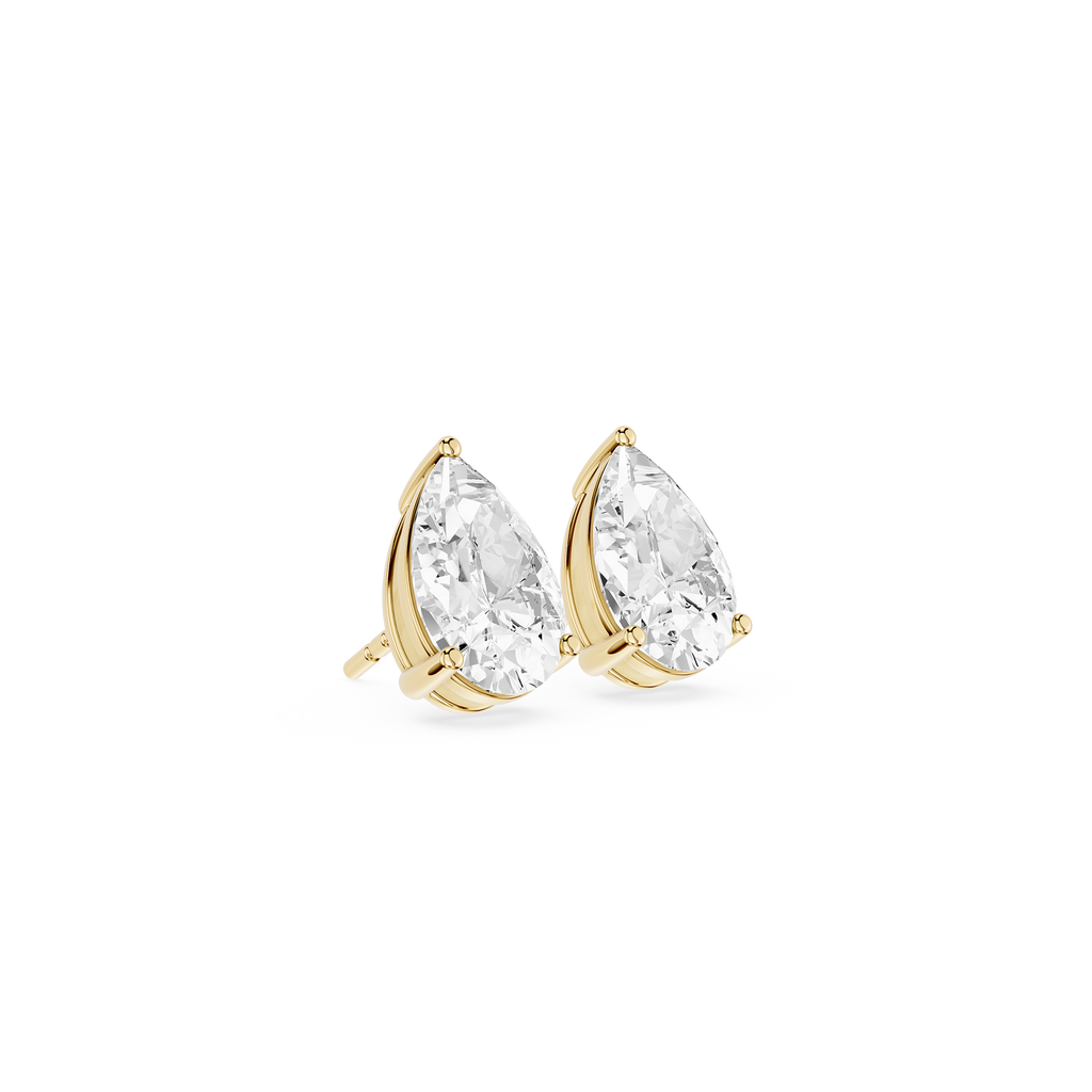 Gold teardrop earrings with clear gemstones on a white background