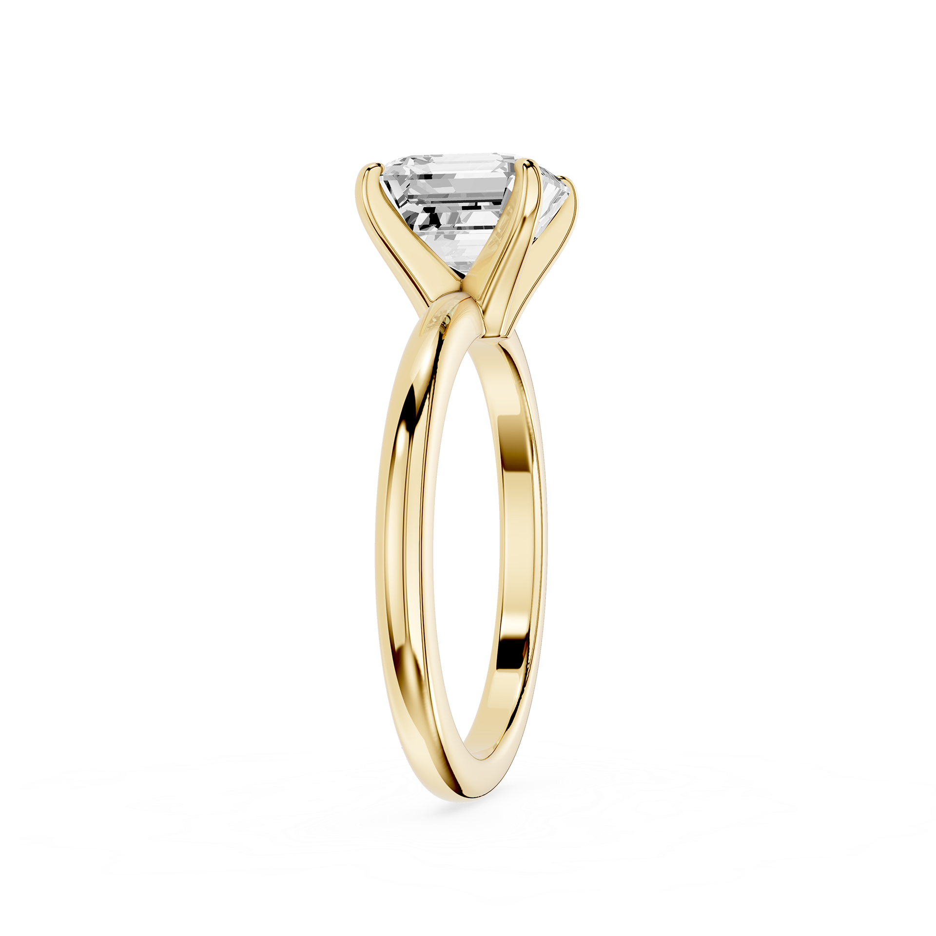 Gold ring with a clear gemstone on a white background