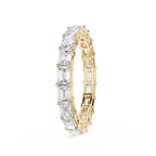 A yellow gold eternity ring featuring a continuous row of clear baguette-cut gemstones, shown on a plain white background.