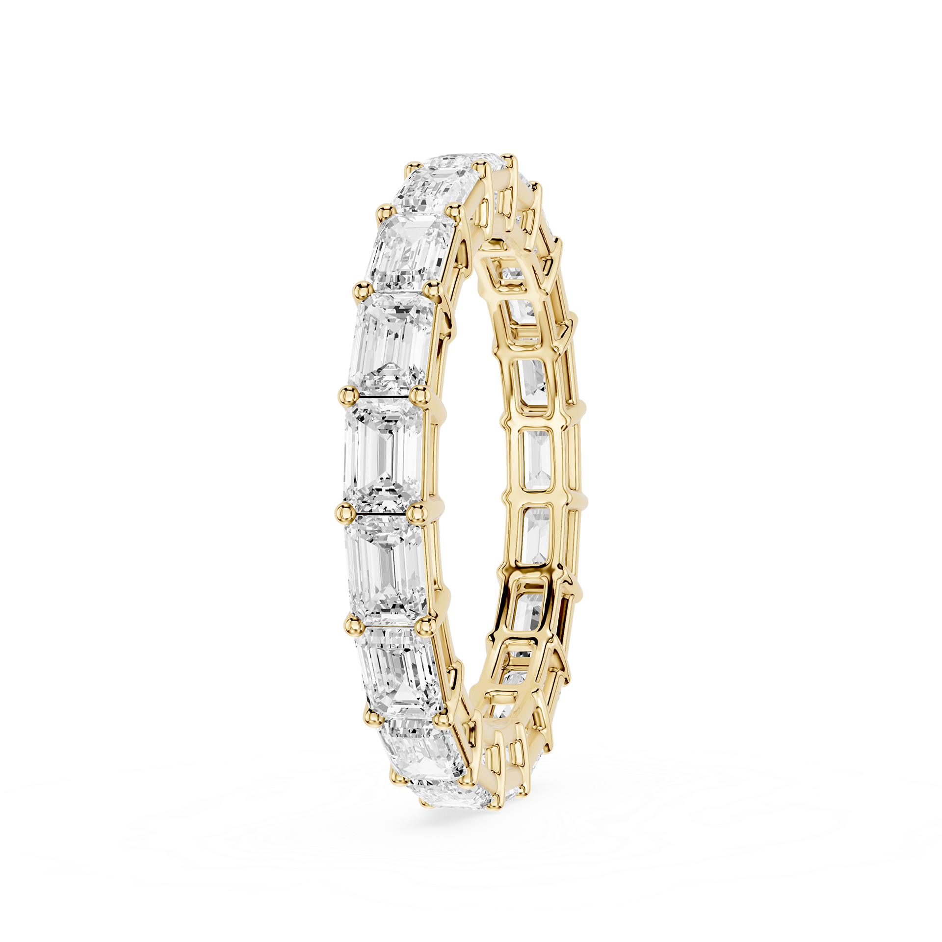 A yellow gold eternity ring featuring a continuous row of clear baguette-cut gemstones, shown on a plain white background.