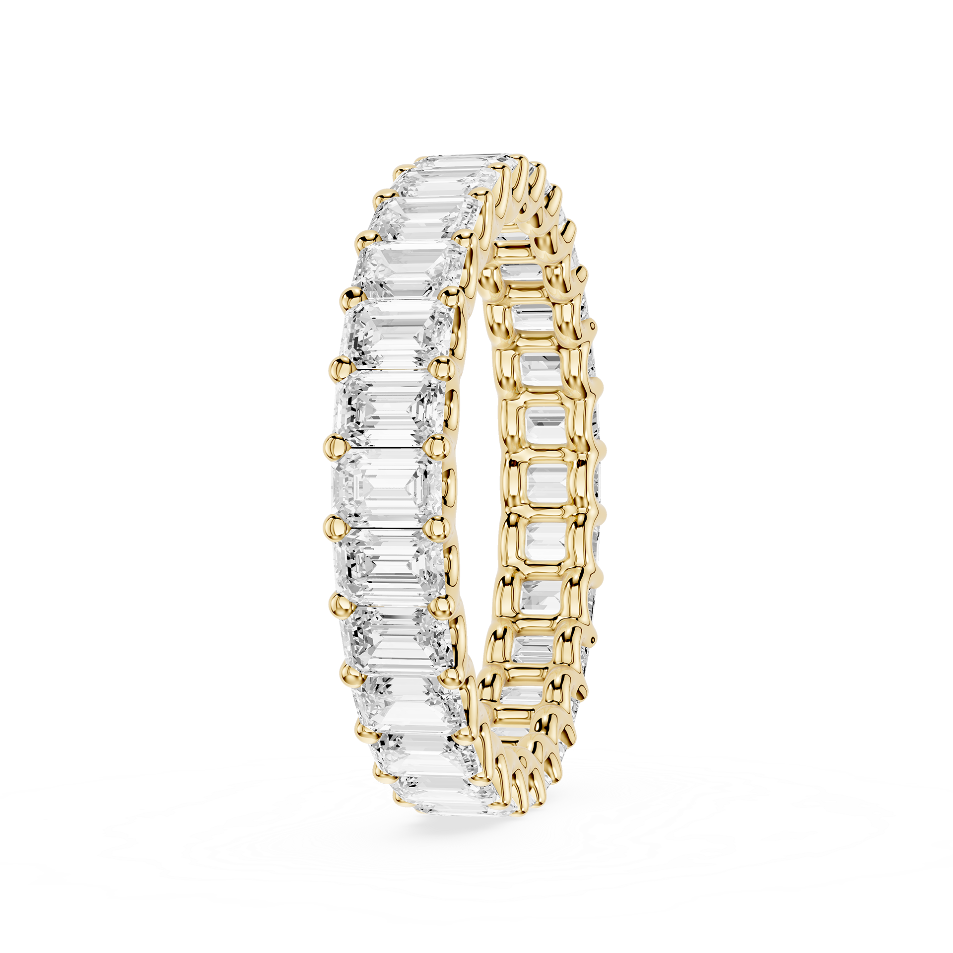 A yellow gold eternity ring featuring a continuous row of baguette-cut clear gemstones on one side and round-cut stones on the other, shown on a plain white background.