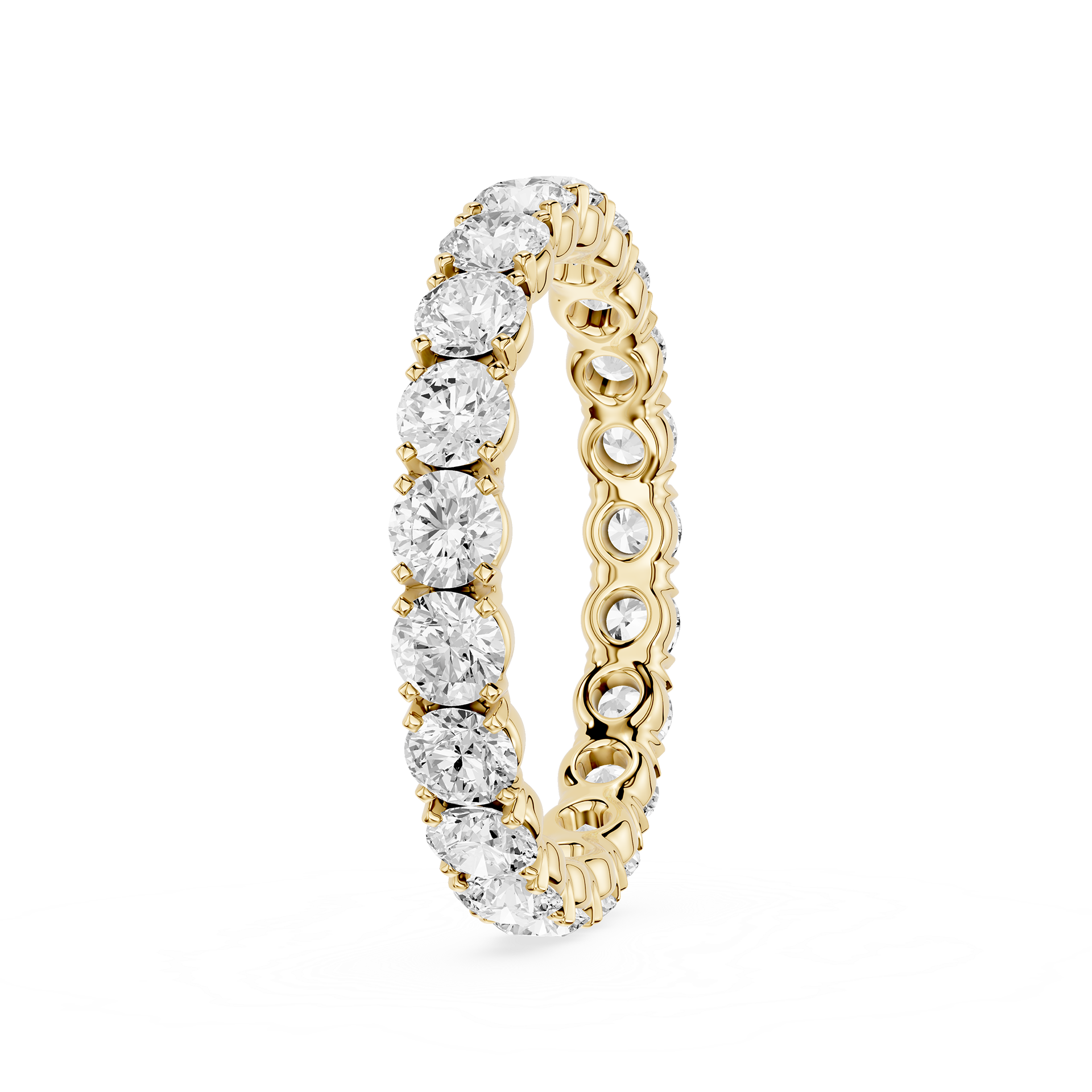 A yellow gold eternity ring featuring a continuous row of round brilliant-cut diamonds on the front and smaller pave-set diamonds on the inner band, shown on a clean white background.