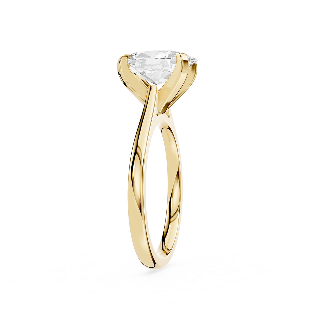 Gold ring with a clear gemstone on a white background