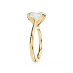 Gold ring with a clear gemstone on a white background