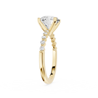 A yellow gold solitaire engagement ring featuring a large round brilliant-cut diamond center stone and a pavé band with small accent diamonds, shown on a plain white background.