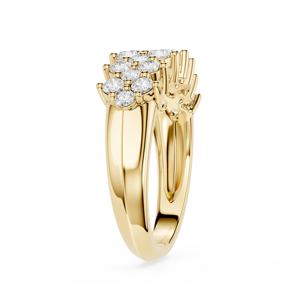 A Yellow-toned split-shank ring with a prominent cluster of round-cut diamonds at the top, shown on a clean white background.