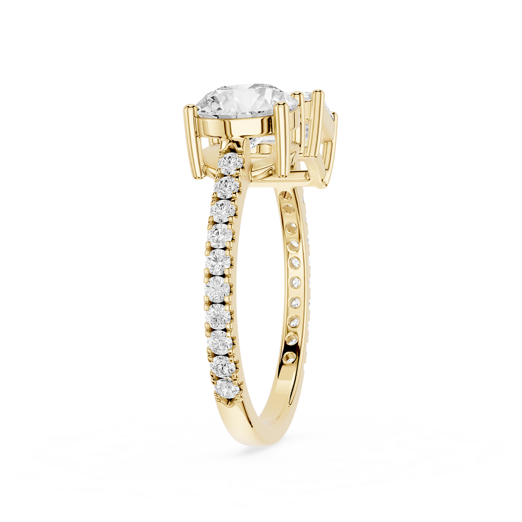 A yellow gold diamond ring with a large round-cut center stone and a pavé band set with small round diamonds, shown on a plain white background.