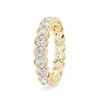 Full eternity diamond ring in yellow gold showcasing round brilliant diamonds framed by curved gold bezels