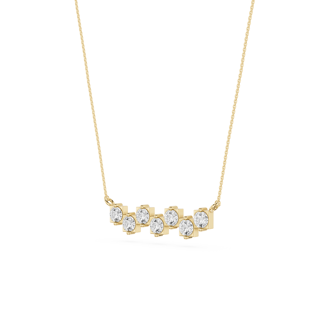 Gold necklace with clear stones on a white background
