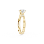 Horizontally set pear shaped lab diamond solitaire ring in yellow gold with an open side setting and crescent bezel
