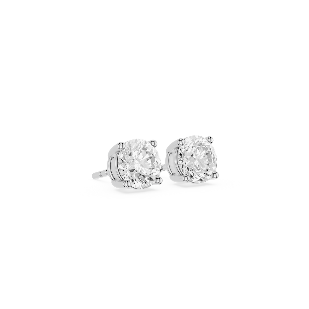Pair of diamond stud earrings on a white background