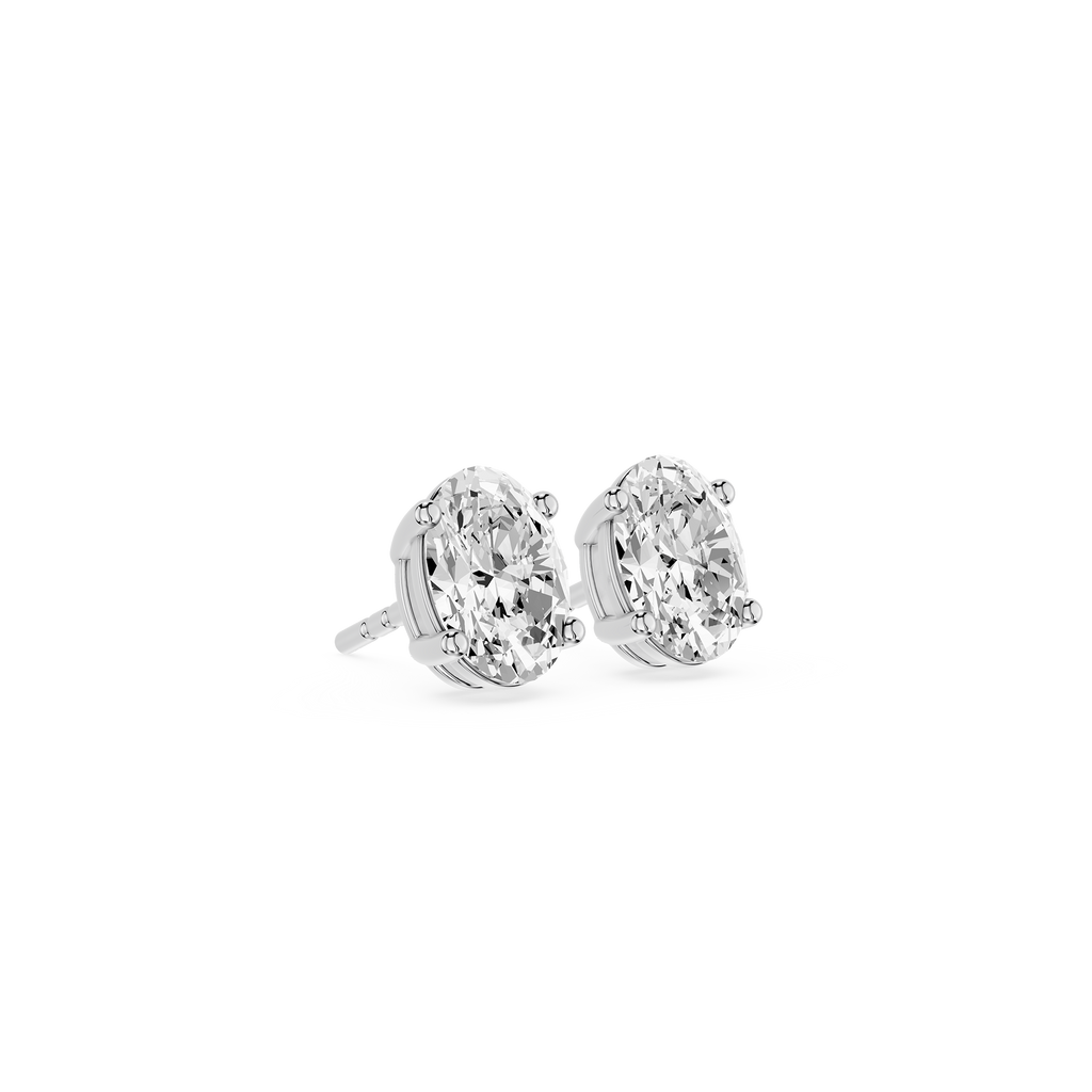 Pair of diamond stud earrings on a white background