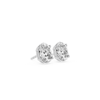 Pair of diamond stud earrings on a white background